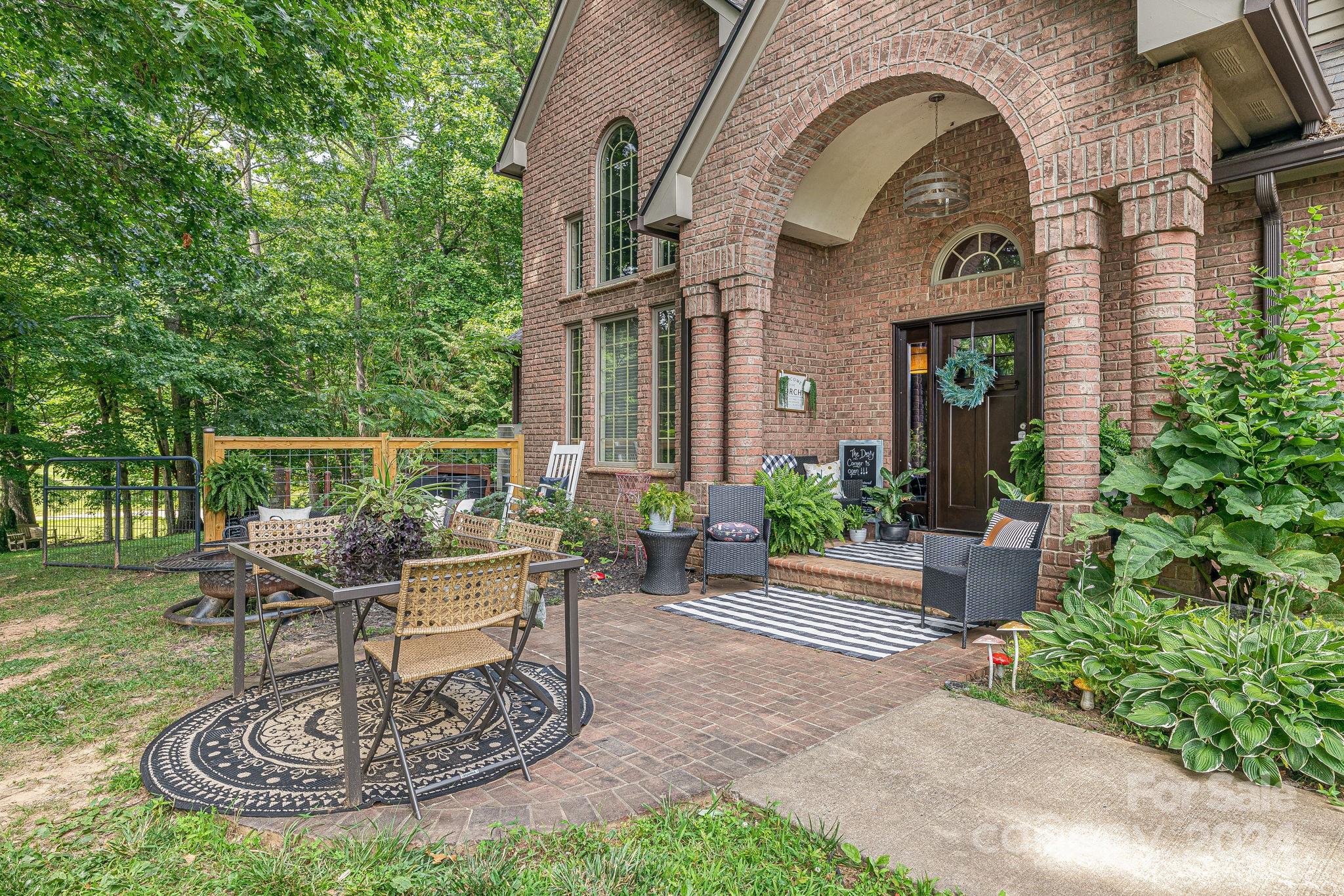 116 Holcombe Cove Road Candler, NC 28715 - Photo 2 of 31 a view of a house with fountain bath tub and a fountain