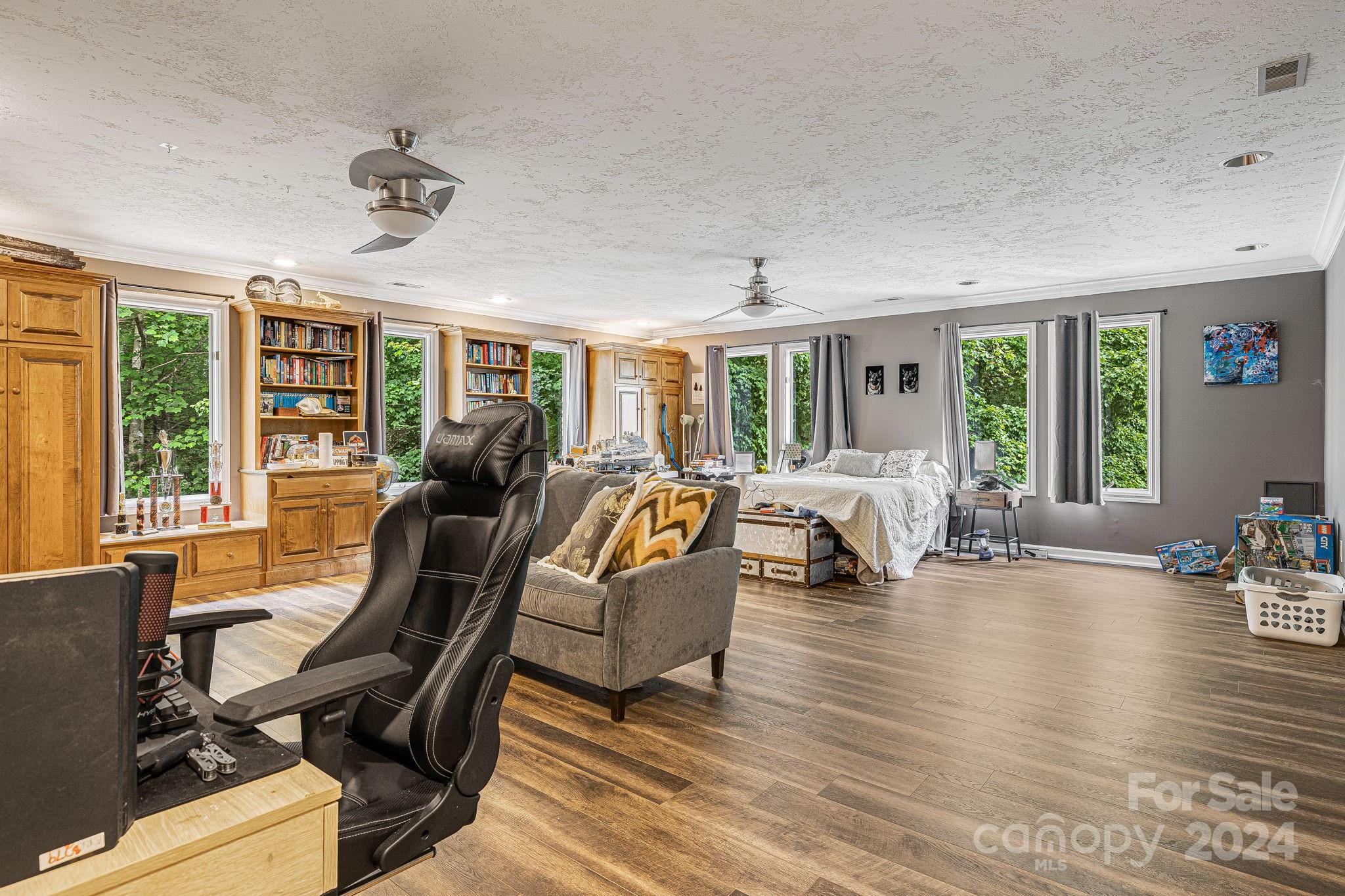 116 Holcombe Cove Road Candler, NC 28715 - Photo 21 of 31 a living room with furniture two large window and wooden floor