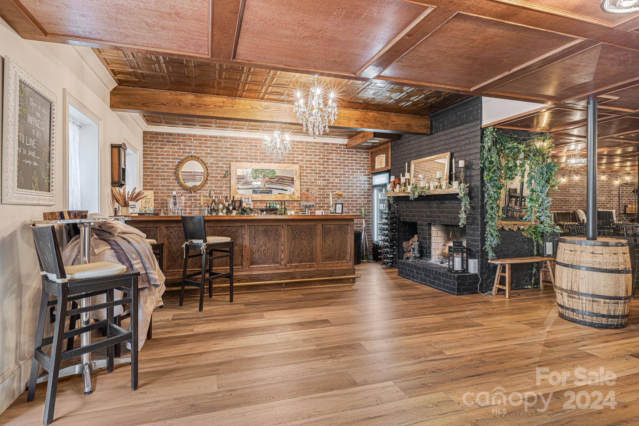 116 Holcombe Cove Road Candler, NC 28715 - Photo 10 of 31 a view of a dining room with wooden floor and furniture