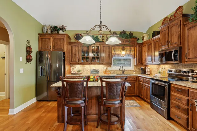a kitchen with a table and chairs in it