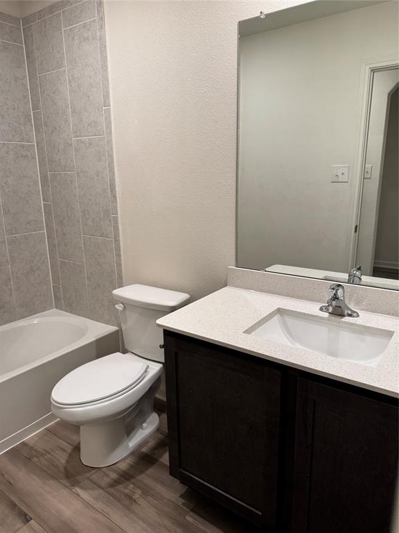 3010 McCoy Road Forney, TX 75126 - Photo 13 of 24 a bathroom with a sink a toilet a mirror and shower