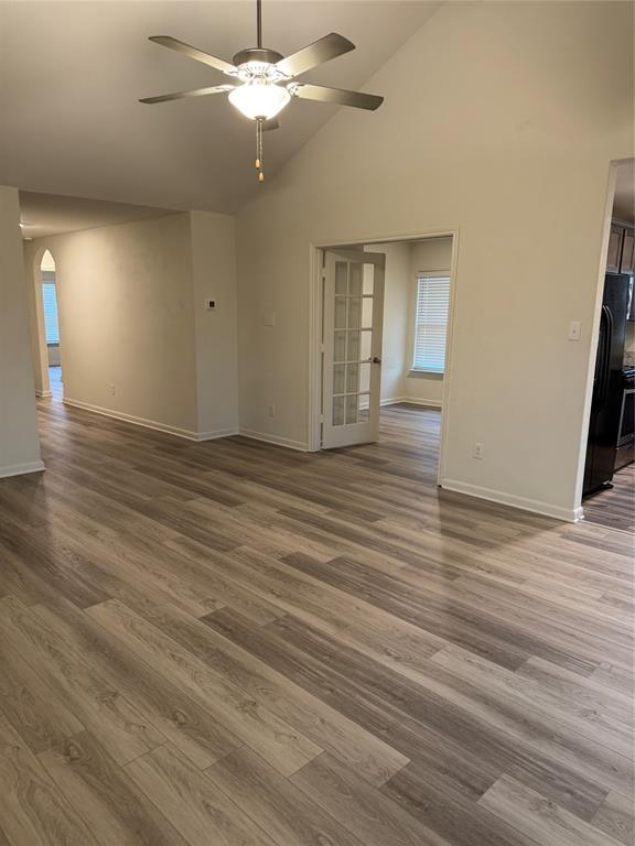 3010 McCoy Road Forney, TX 75126 - Photo 3 of 24 wooden floor in an empty room with a window