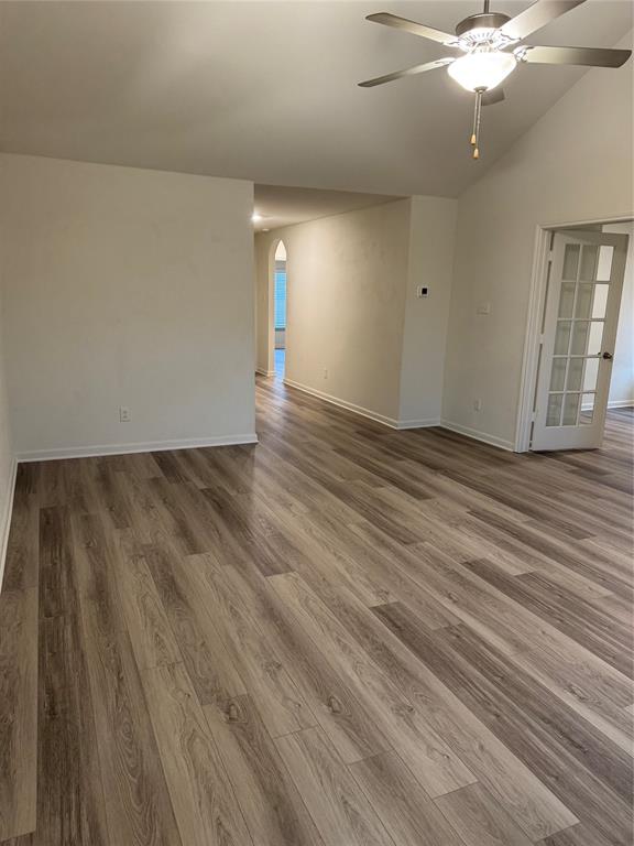 3010 McCoy Road Forney, TX 75126 - Photo 5 of 24 wooden floor in an empty room with a window