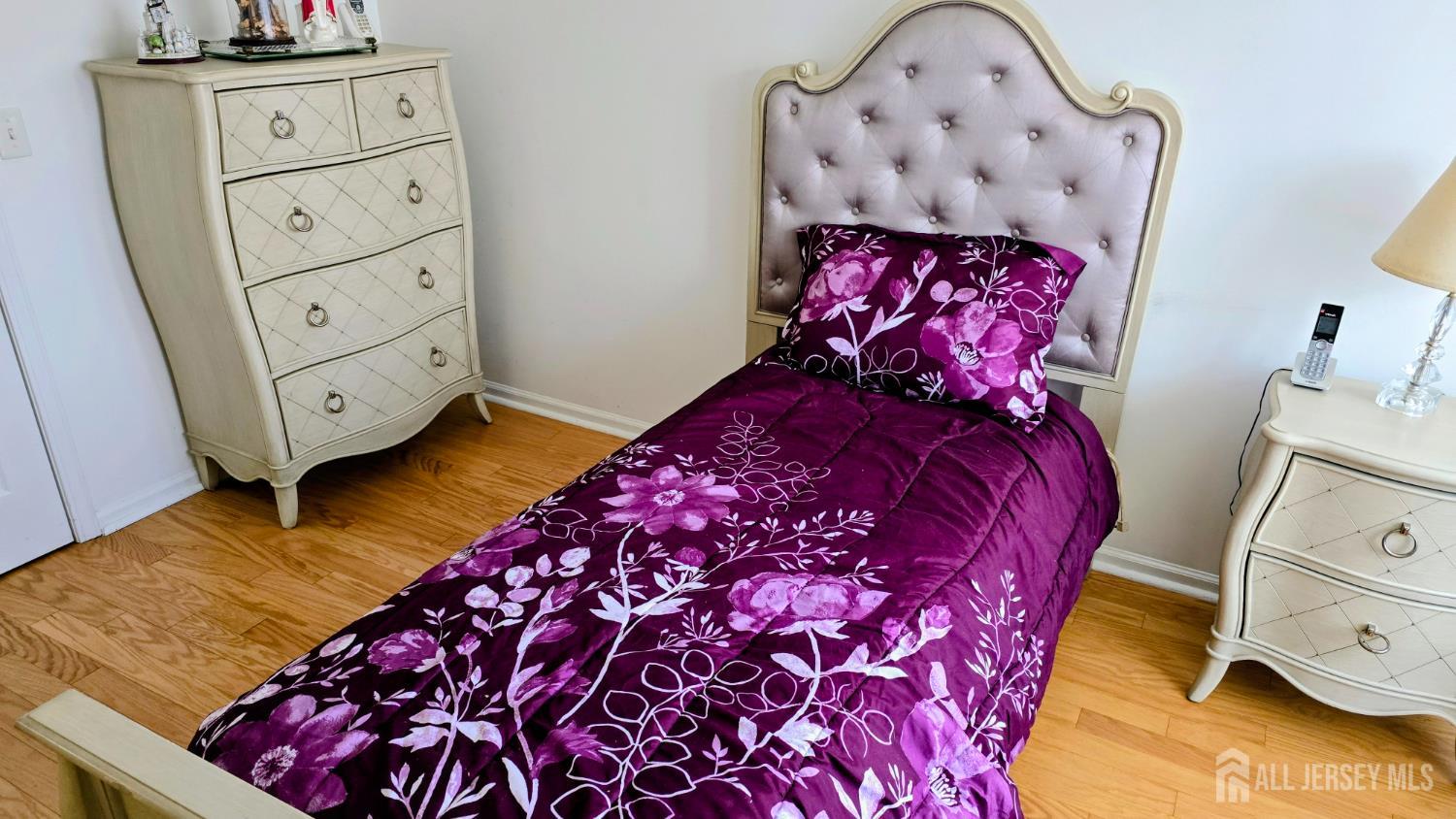 205 Liddle Avenue Edison, NJ 08837 - Photo 14 of 32 a bed room with a bed in it and mirror