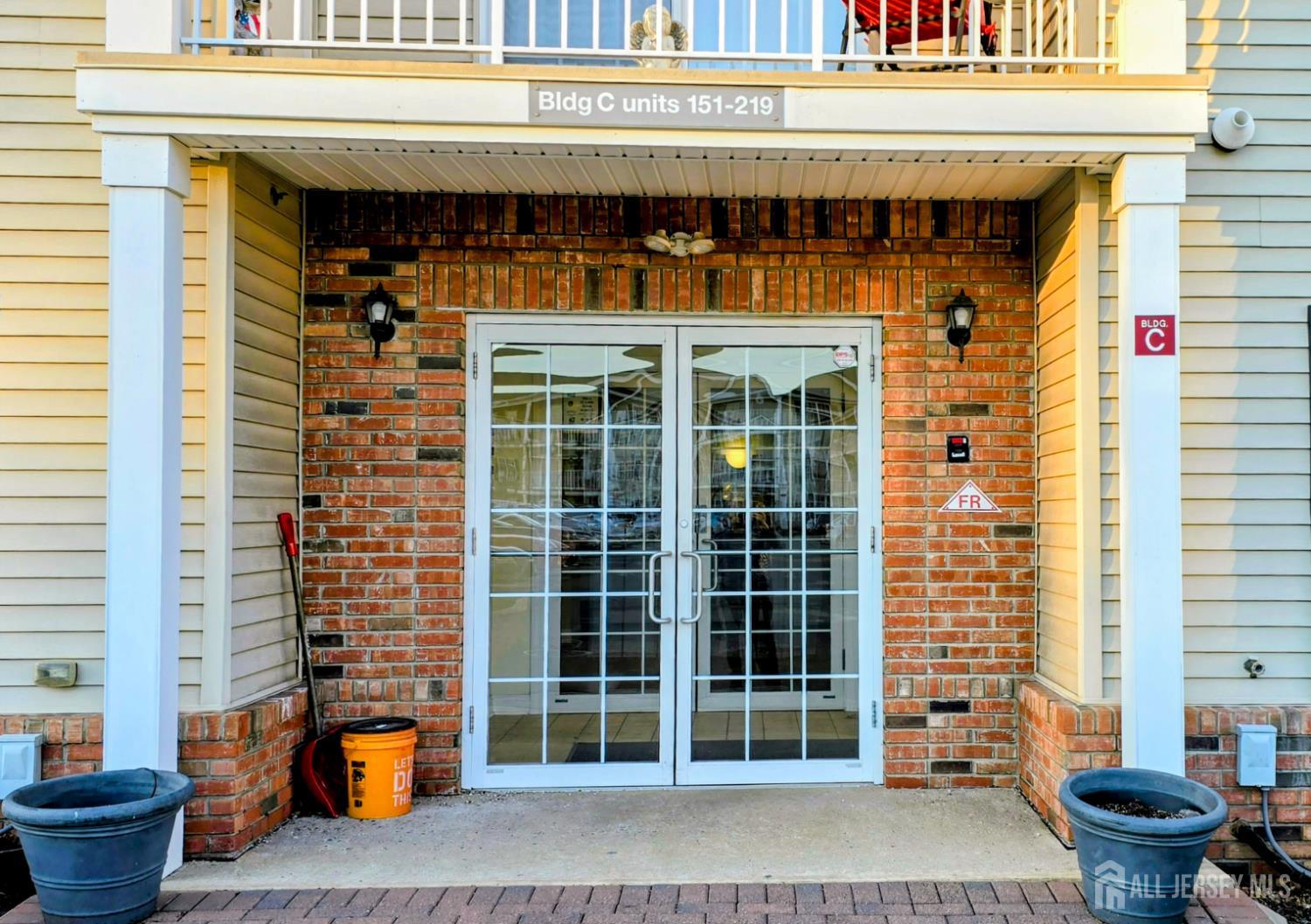 205 Liddle Avenue Edison, NJ 08837 - Photo 2 of 32 a front view of a building with glass windows and door
