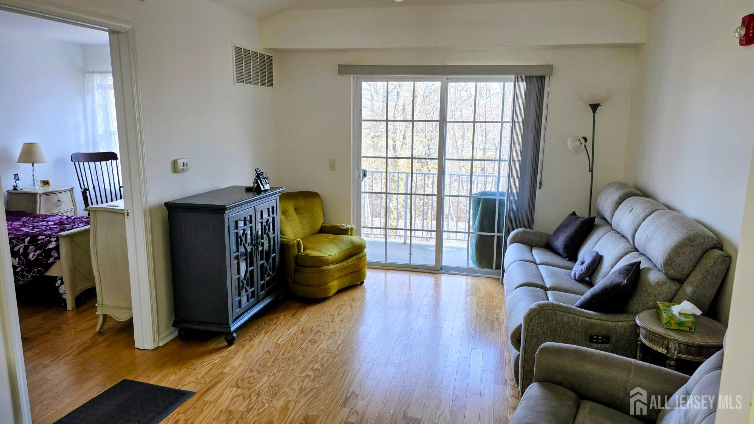 205 Liddle Avenue Edison, NJ 08837 - Photo 9 of 32 a living room with furniture and a window