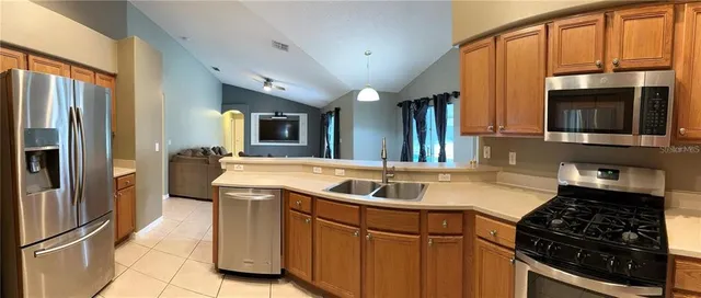 a kitchen that has a sink and a stove