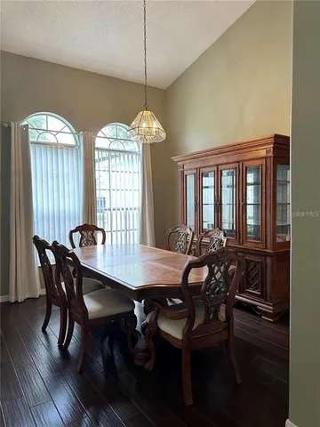 a view of a dining room with furniture window and outside view