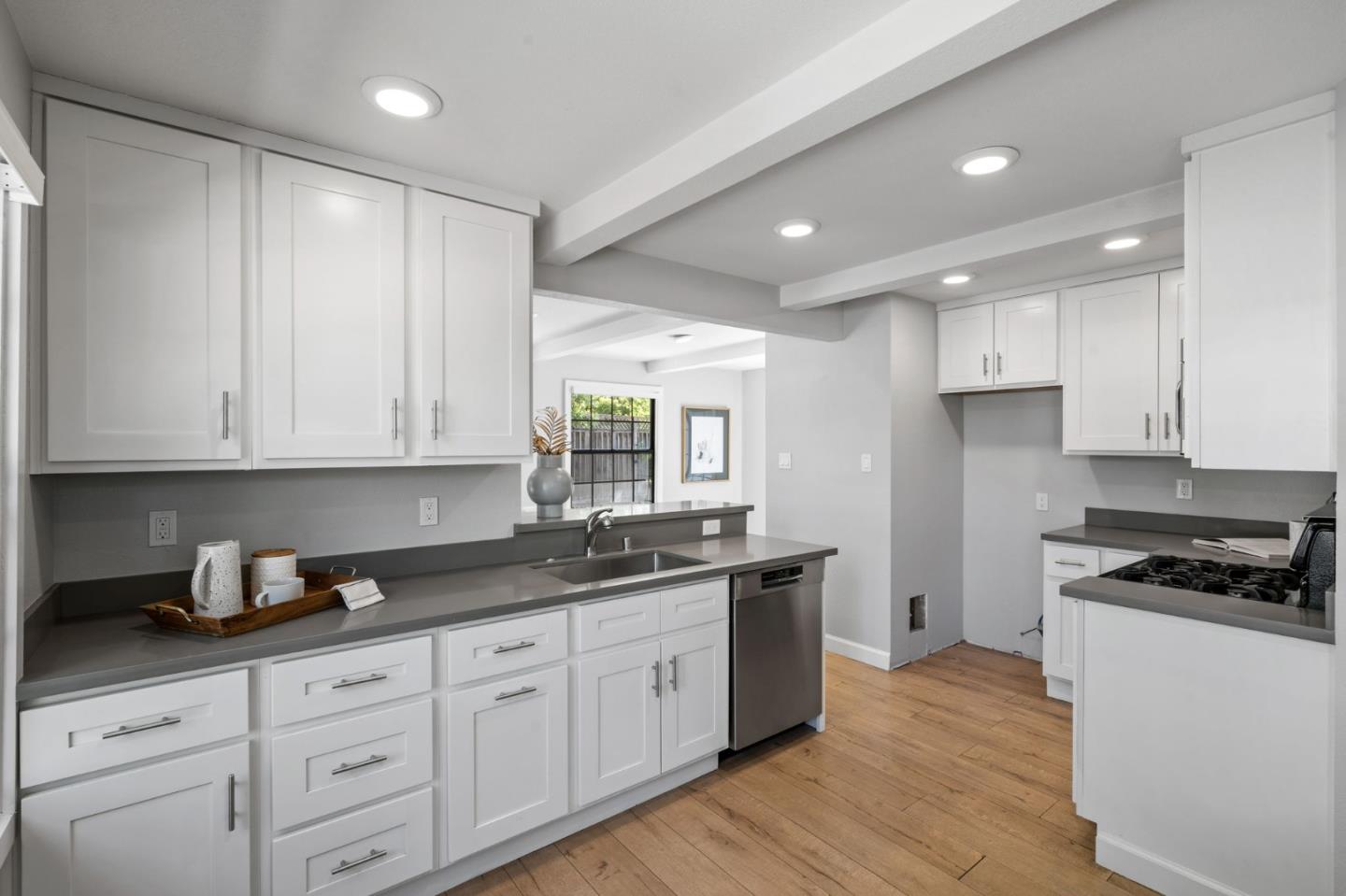 1363 Ramon Drive Sunnyvale, CA 94087 - Photo 16 of 36 a kitchen with granite countertop white cabinets and white appliances