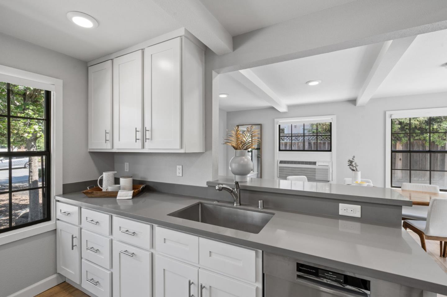 1363 Ramon Drive Sunnyvale, CA 94087 - Photo 18 of 36 a kitchen with granite countertop a sink and white cabinets