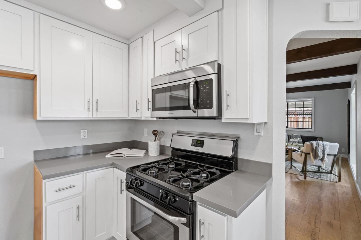 1363 Ramon Drive Sunnyvale, CA 94087 - Photo 19 of 36 a kitchen with stainless steel appliances granite countertop a stove and a microwave