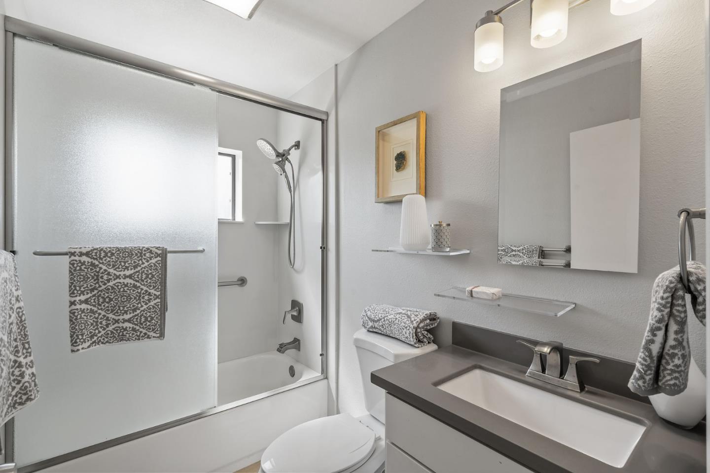 1363 Ramon Drive Sunnyvale, CA 94087 - Photo 22 of 36 a bathroom with a granite countertop sink toilet and shower