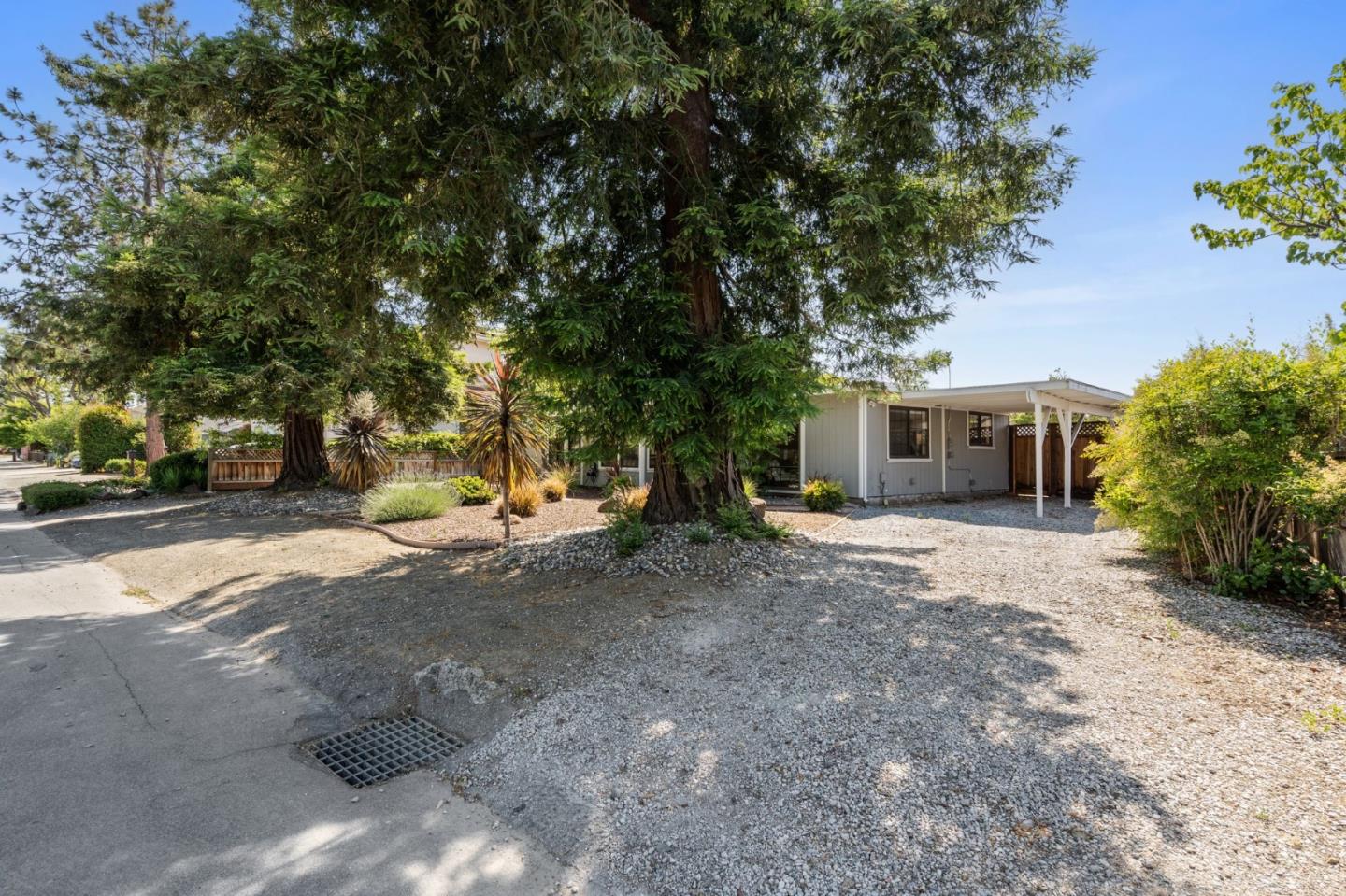 1363 Ramon Drive Sunnyvale, CA 94087 - Photo 3 of 36 a view of a house with a yard and garage