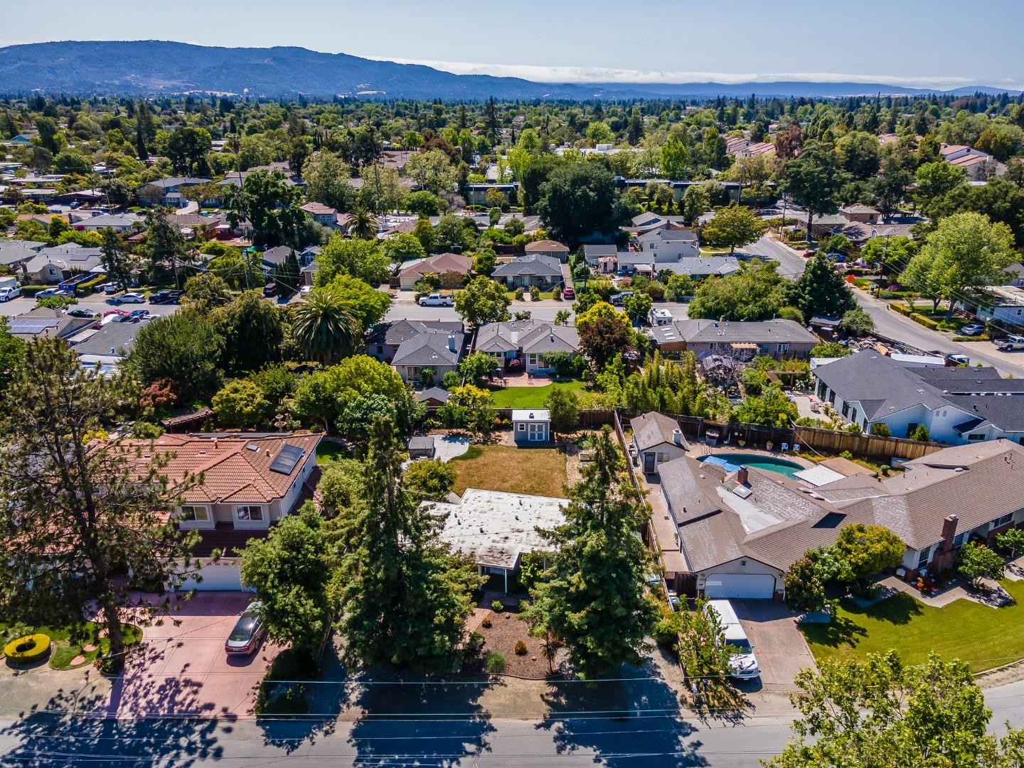1363 Ramon Drive Sunnyvale, CA 94087 - Photo 33 of 36 an aerial view of a city with lots of residential buildings and mountain view in back