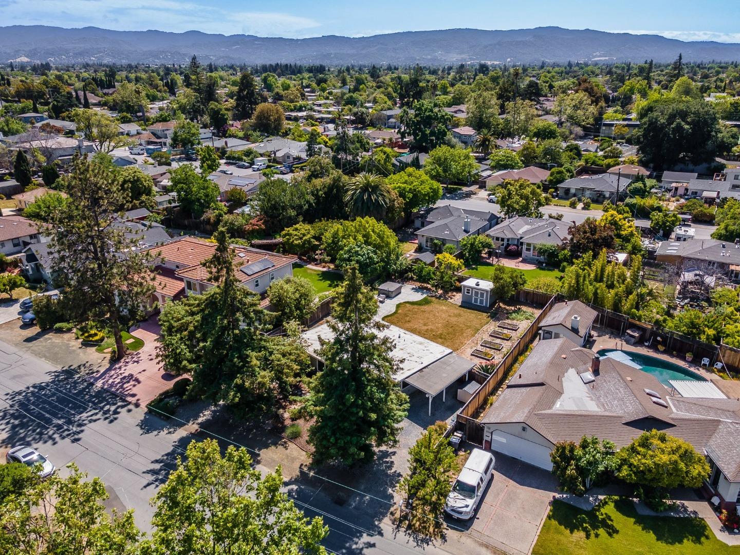 1363 Ramon Drive Sunnyvale, CA 94087 - Photo 36 of 36 an aerial view of a city with lots of residential buildings and mountain view in back
