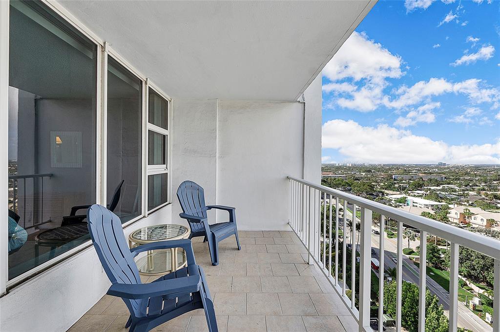 1620 South Ocean Boulevard, Unit 15J Lauderdale-by-the-Sea, FL 33062 - Photo 11 of 28 a view of a balcony with chair and table