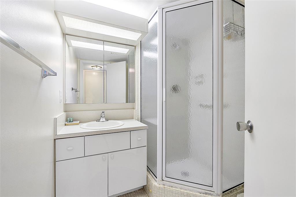 1620 South Ocean Boulevard, Unit 15J Lauderdale-by-the-Sea, FL 33062 - Photo 14 of 28 a bathroom with a double vanity sink mirror and shower