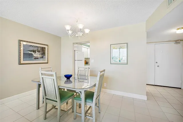 a view of washer and dryer with kitchen in the background