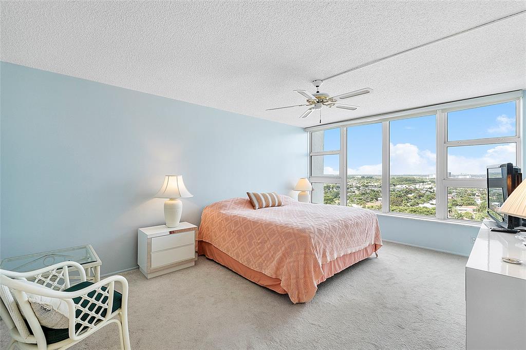 1620 South Ocean Boulevard, Unit 15J Lauderdale-by-the-Sea, FL 33062 - Photo 10 of 28 a room with a bed window and a couch