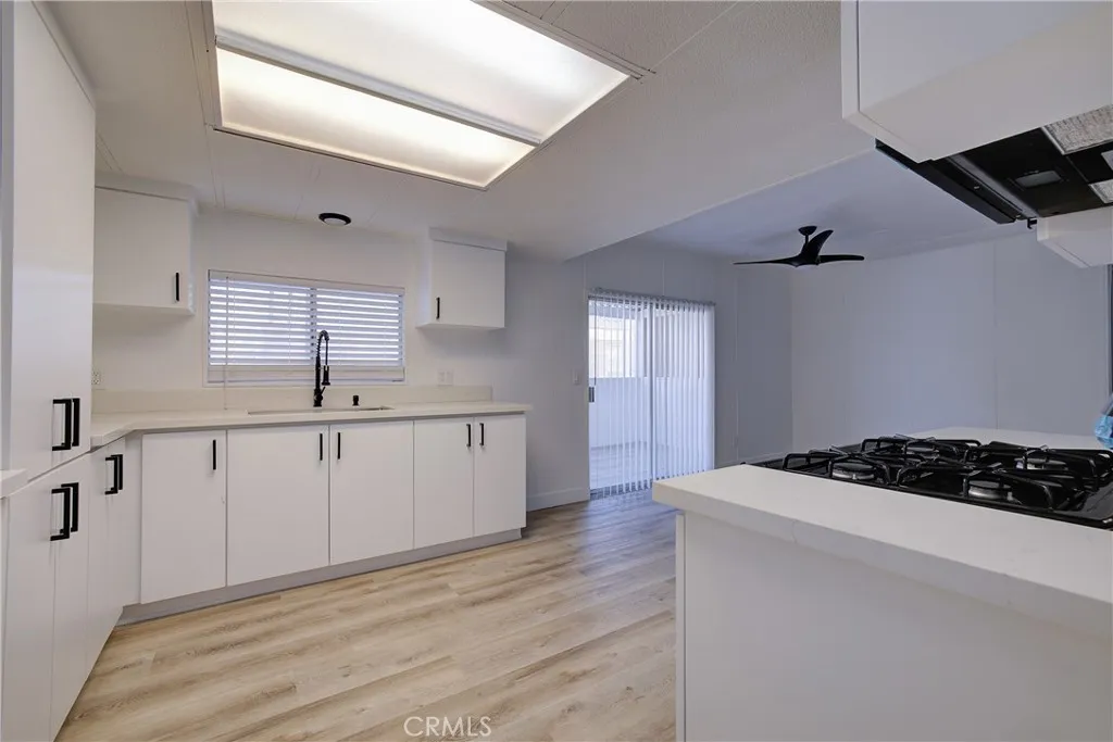 3700 Buchanan Street, Unit 164 Riverside, CA 92503 - Photo 10 of 40 a kitchen with a sink stove and cabinets
