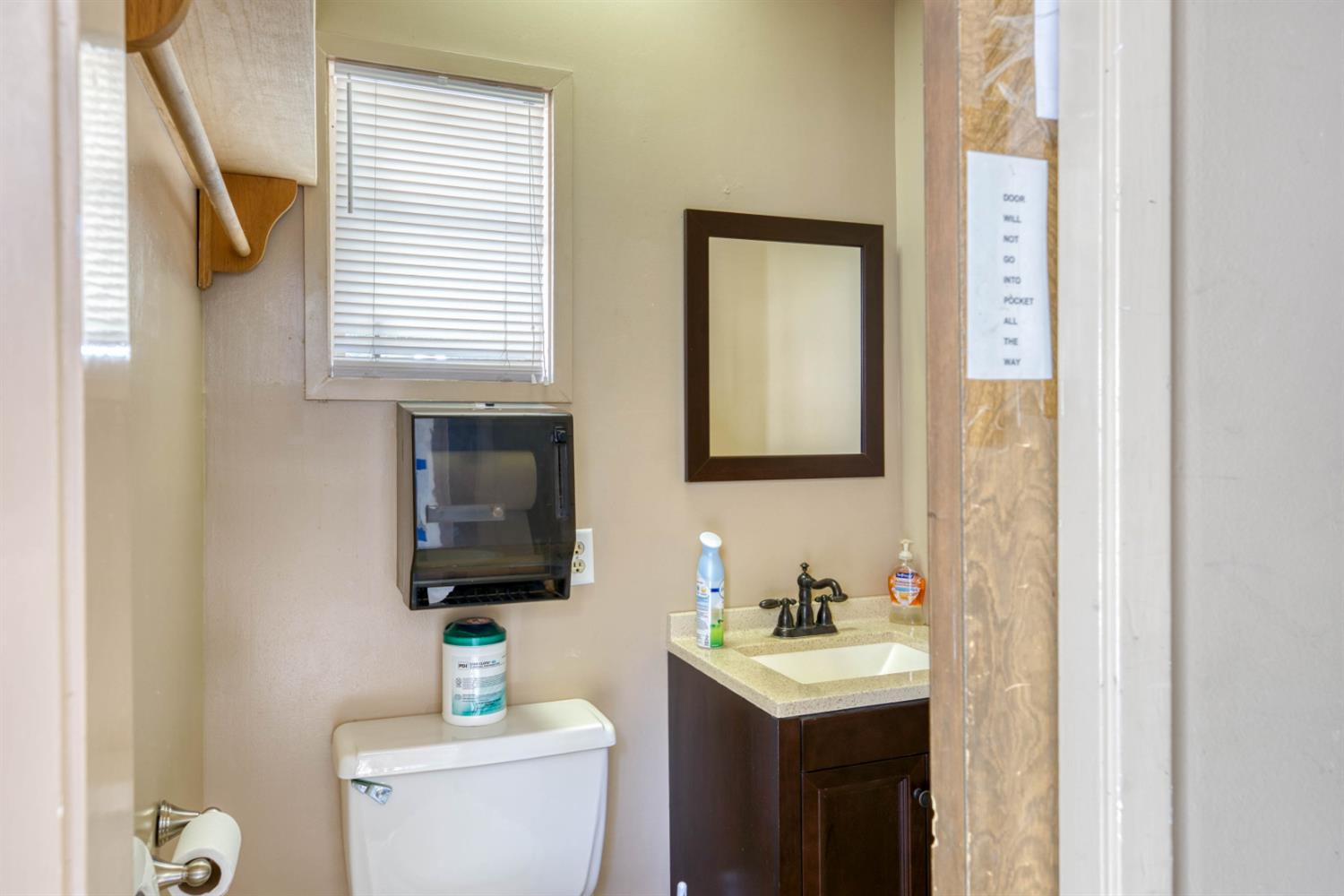 41593 Tollhouse Road Shaver Lake, CA 93664 - Photo 28 of 55 a bathroom with a toilet sink and mirror