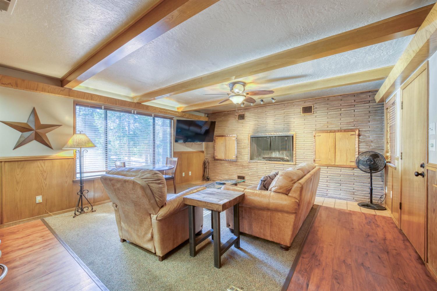 41593 Tollhouse Road Shaver Lake, CA 93664 - Photo 49 of 55 a living room with furniture and a wooden floor