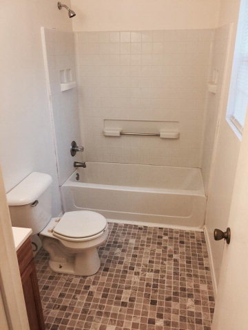 133 Stirk Road Macon, GA 31211 - Photo 9 of 16 a bathroom with a toilet and a shower