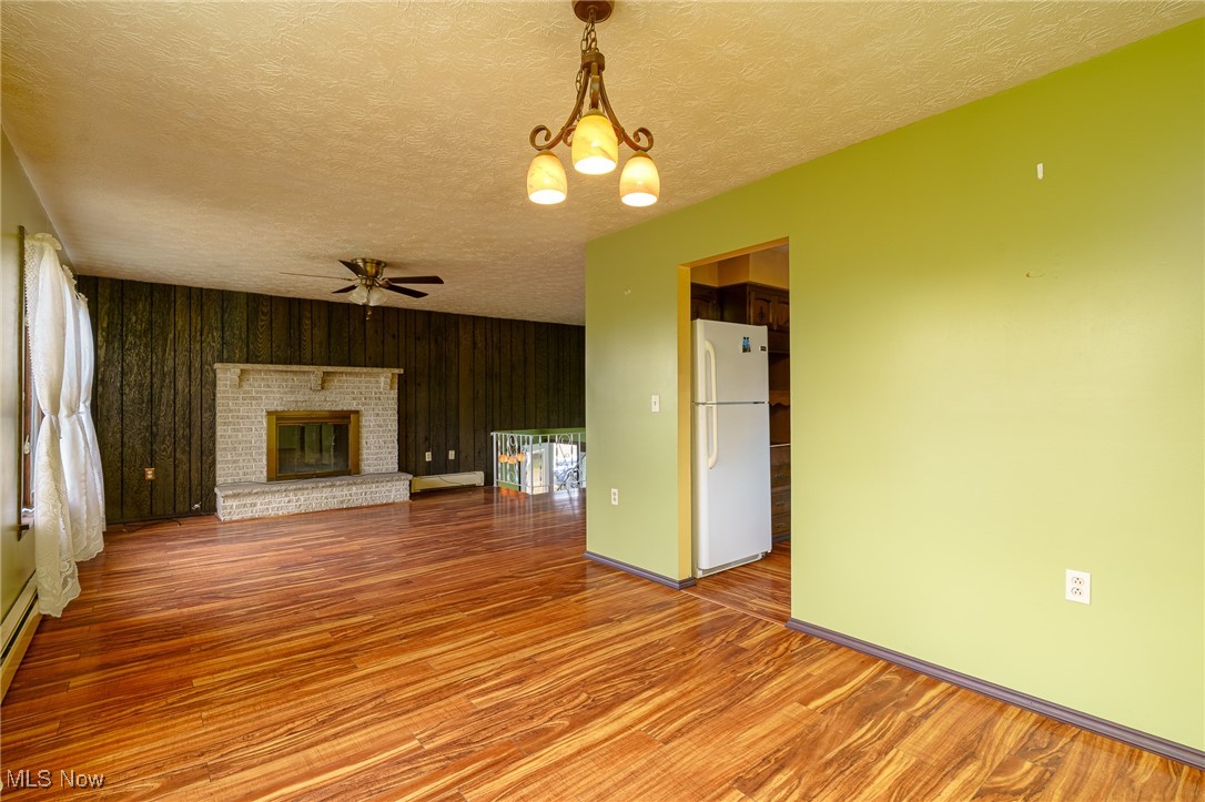 6747 Giddings Road Rootstown, OH 44272 - Photo 8 of 39 Dining room showing living room and fireplace