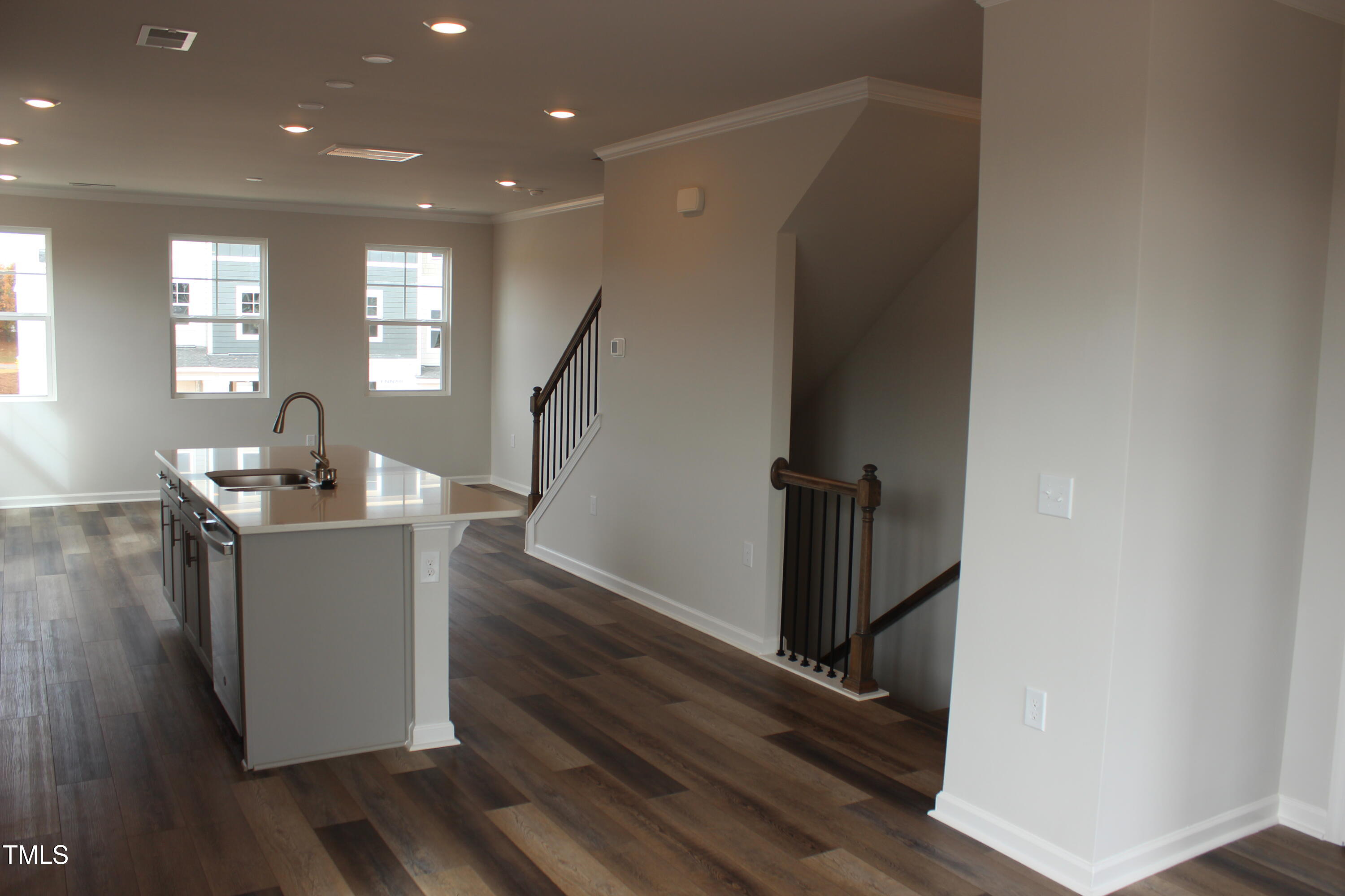 364 Devon Clfs Drive Wake Forest, NC 27587 - Photo 4 of 30 a view of a hallway with wooden floor and staircase