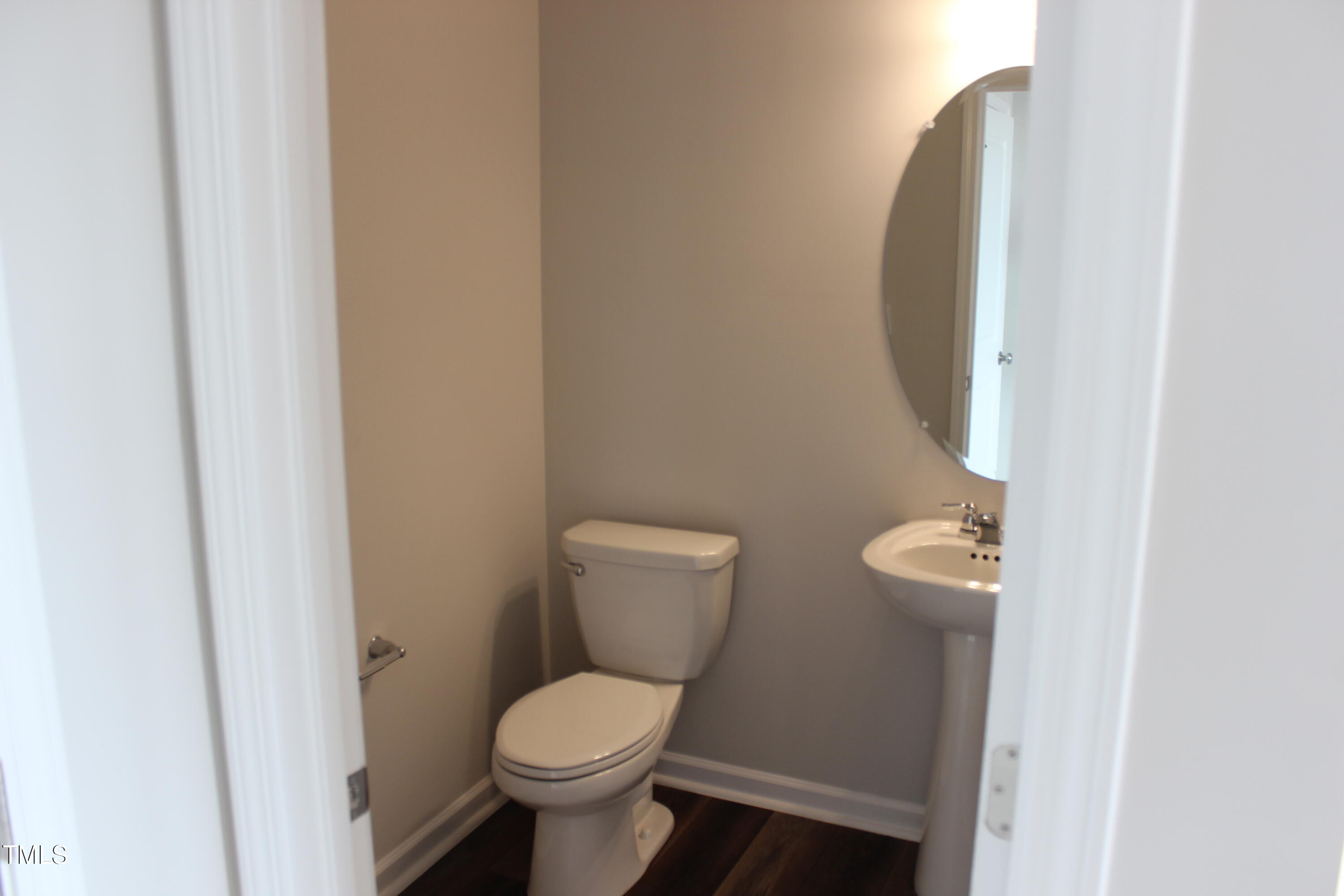 364 Devon Clfs Drive Wake Forest, NC 27587 - Photo 7 of 30 a white toilet sitting next to a bathroom sink