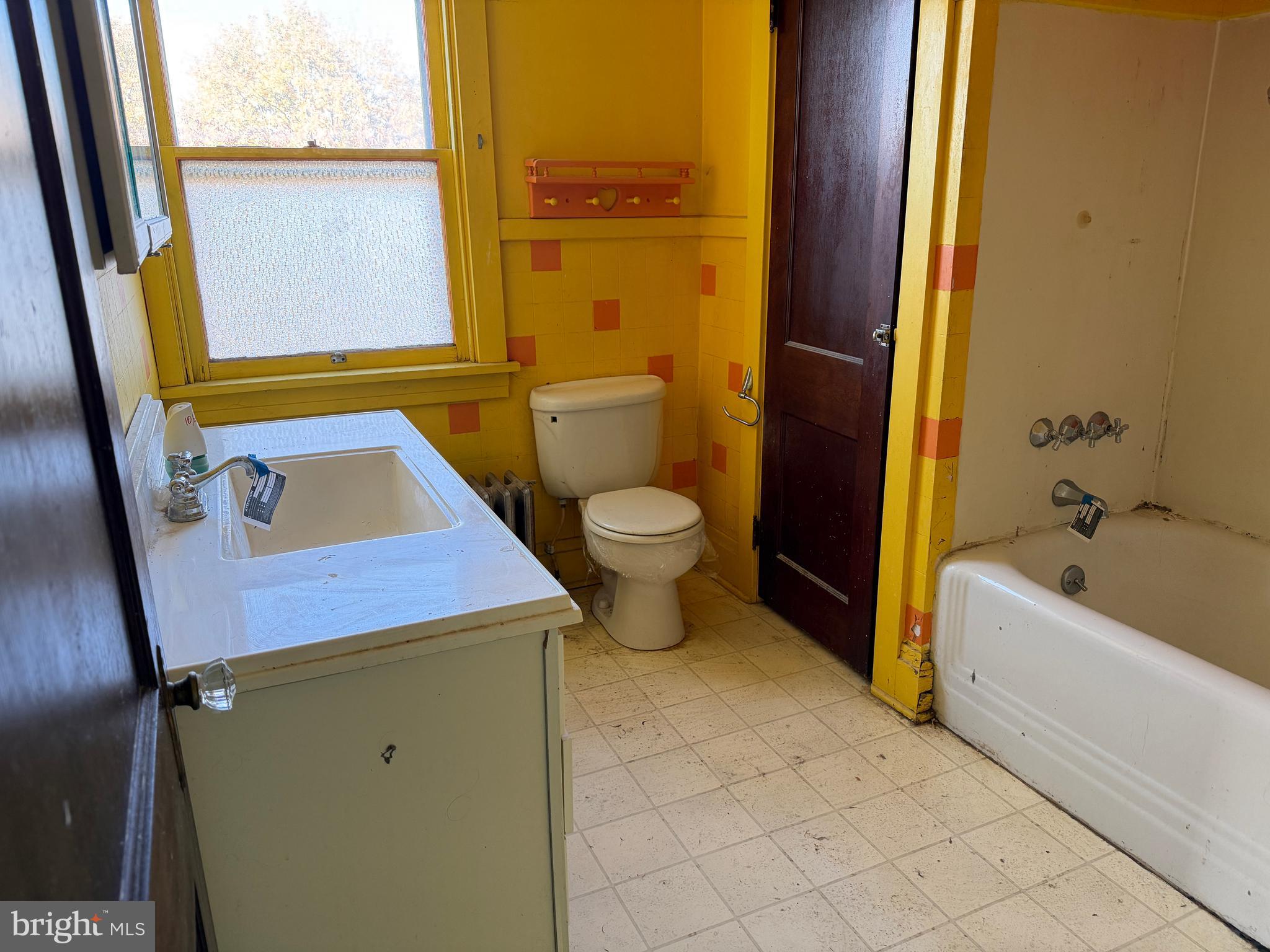 3428 Old Orchard Road Harrisburg, PA 17109 - Photo 16 of 22 a bathroom with a sink a toilet and tub