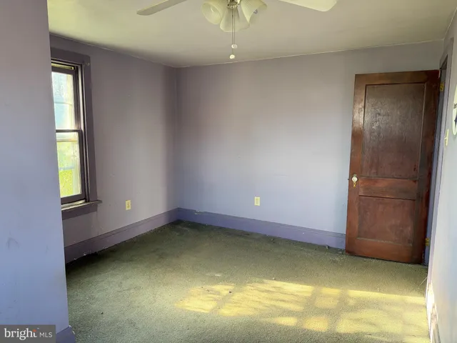 a view of room with window and tub
