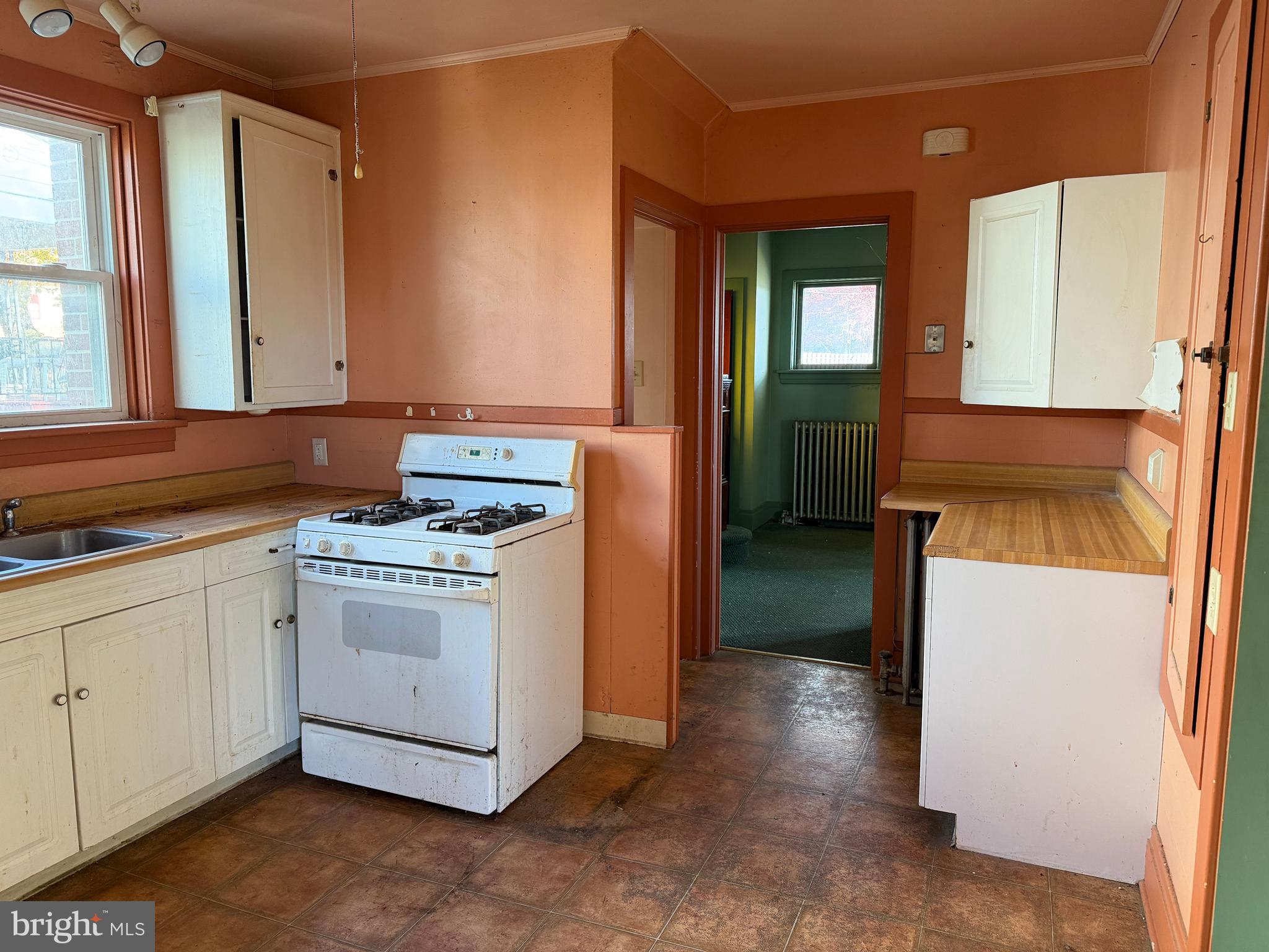 3428 Old Orchard Road Harrisburg, PA 17109 - Photo 10 of 22 a utility room with closet a stove and a window