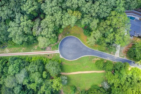 a view of a swimming pool with a patio
