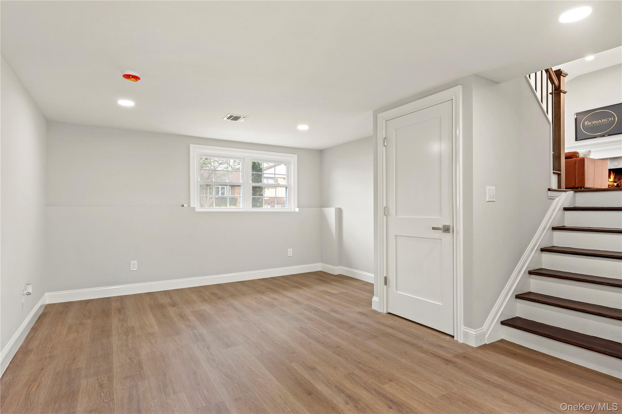 16 Eleanor Road Plainview, NY 11803 - Photo 19 of 28 Finished family room with wood-finish flooring and recessed lighting