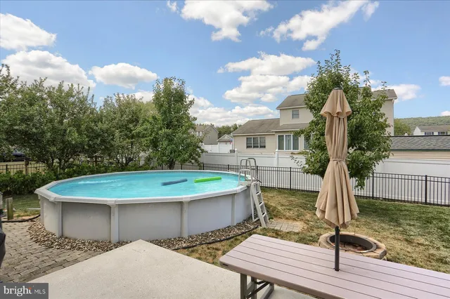 a view of a backyard with furniture