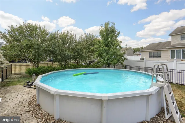 a view of backyard with a garden and deck