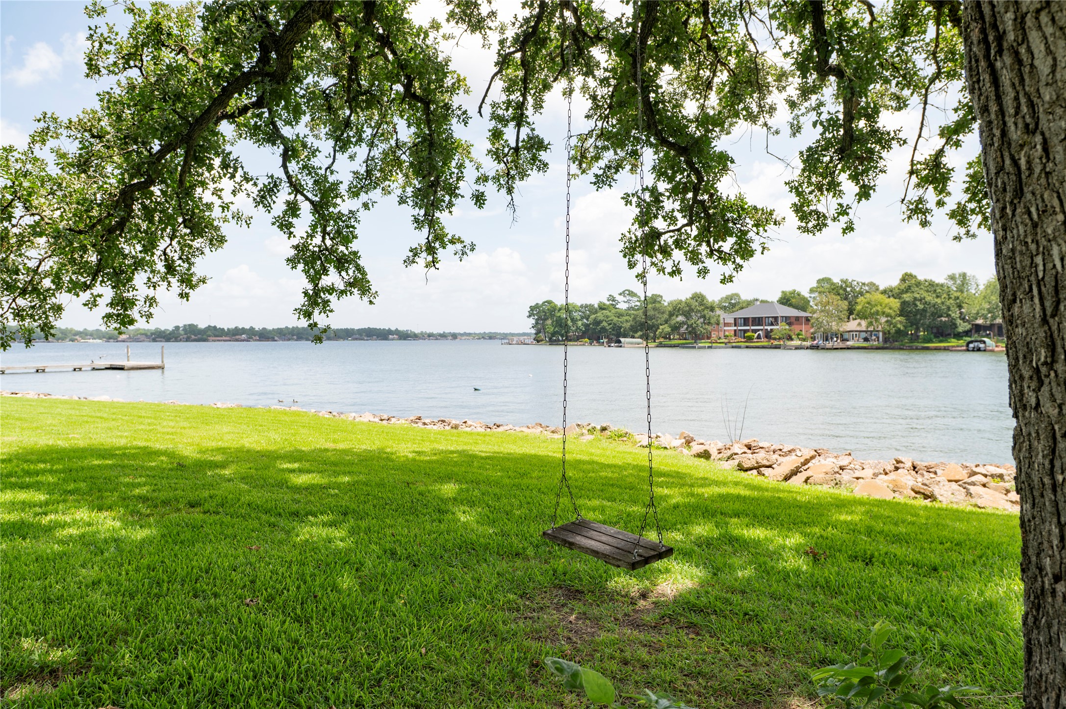 1436 Bowsprit Point Willis, TX 77318 - Photo 2 of 20 a view of a lake with houses in the back