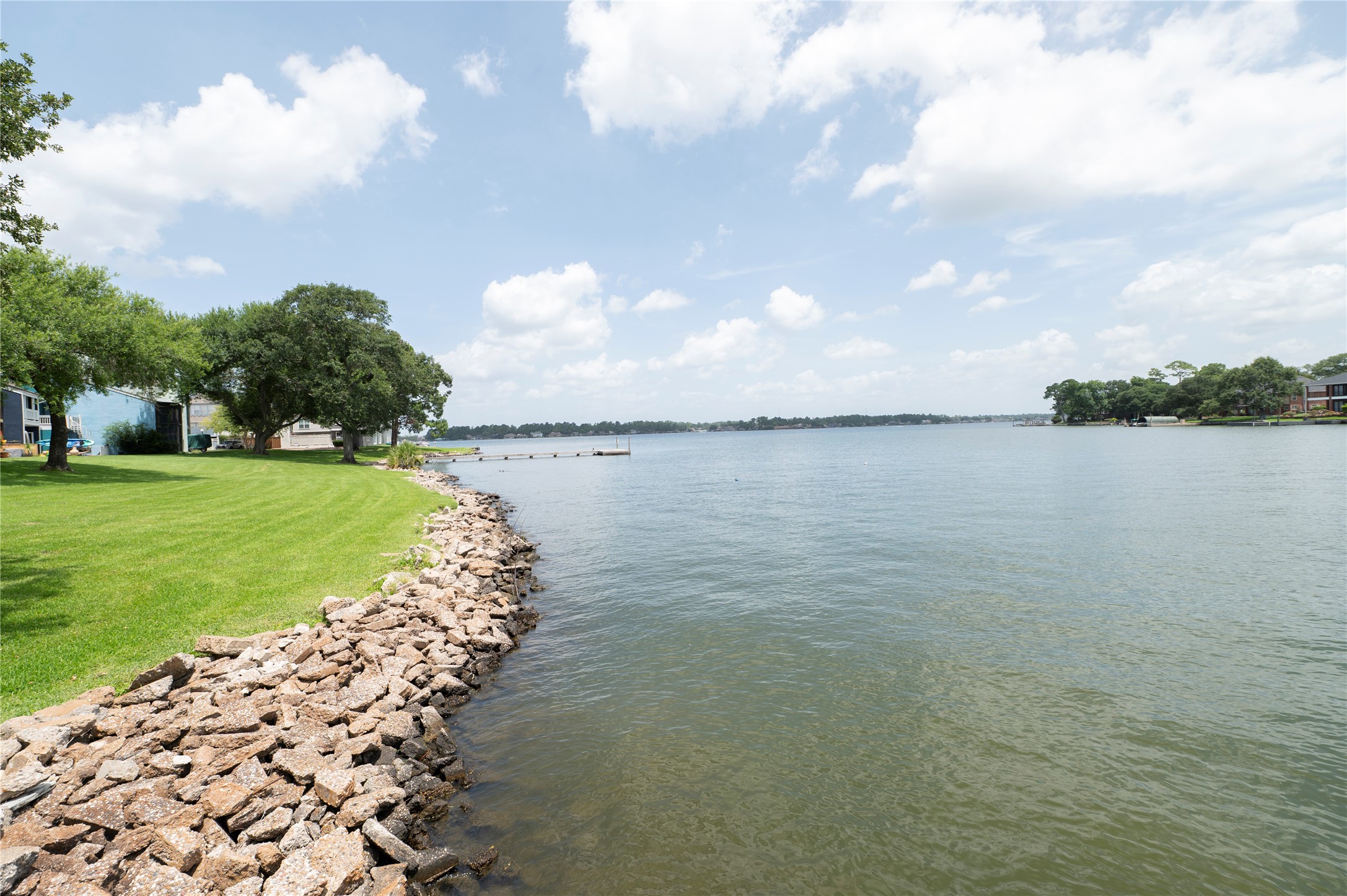 1436 Bowsprit Point Willis, TX 77318 - Photo 3 of 20 a view of a lake with a big yard