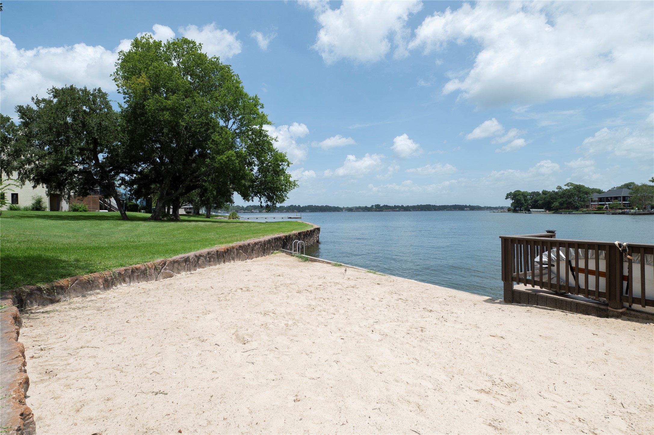 1436 Bowsprit Point Willis, TX 77318 - Photo 10 of 20 a view of a lake with a yard