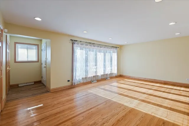 a view of a dining room with furniture and a chandelier