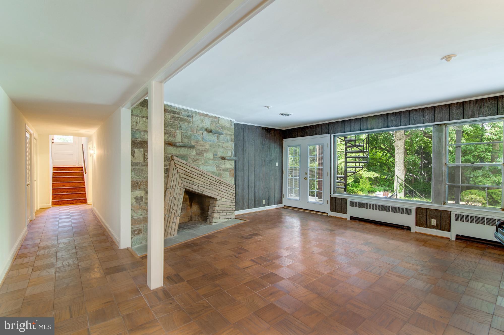 8117 Rayburn Road Bethesda, MD 20817 - Photo 21 of 30 Downstairs Family room opens to flagstone patio