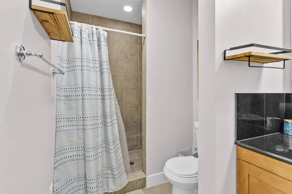 a kitchen with stainless steel appliances a sink and a refrigerator