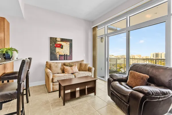 a living room with furniture and a large window