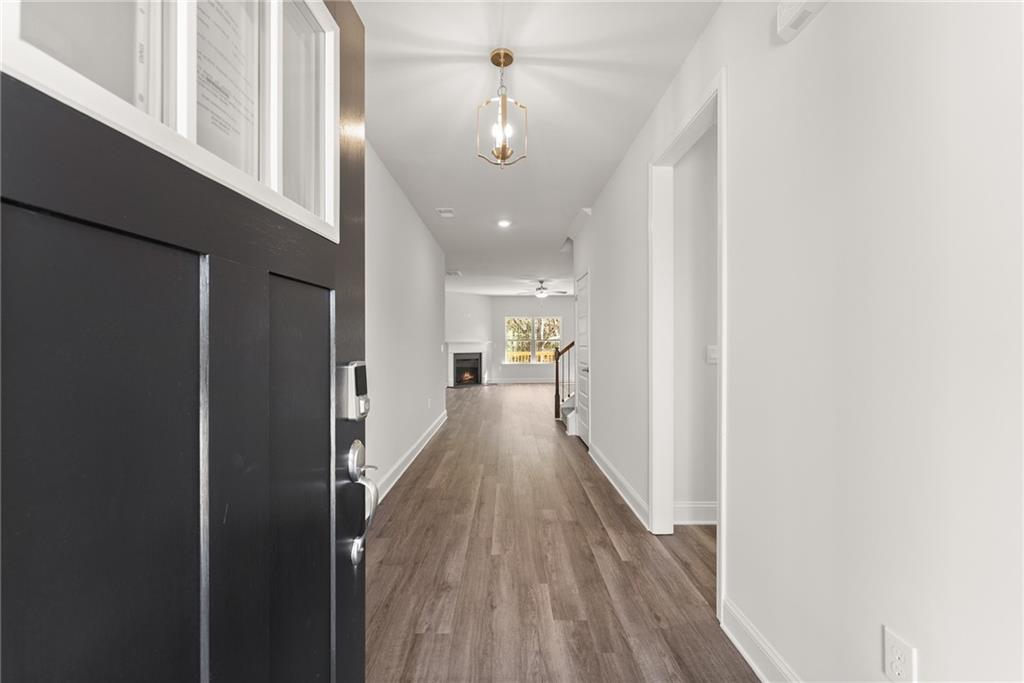 642 Bald Ridge Circle Demorest, GA 30535 - Photo 3 of 18 a view of a hallway with wooden floor and a large window