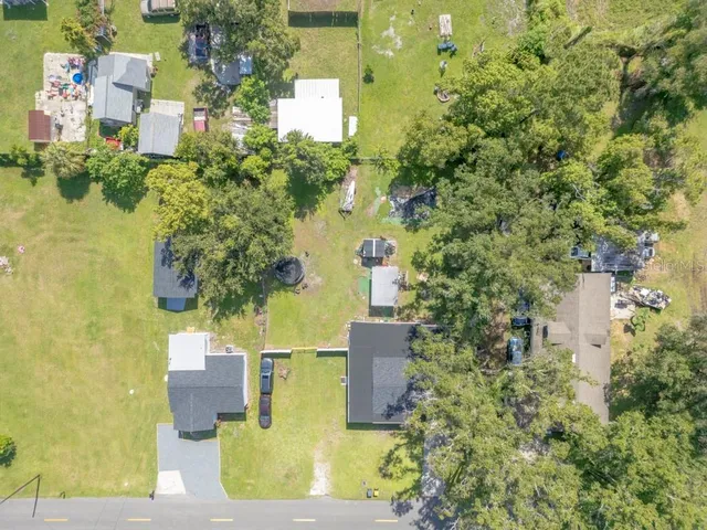 aerial view of a house with a yard