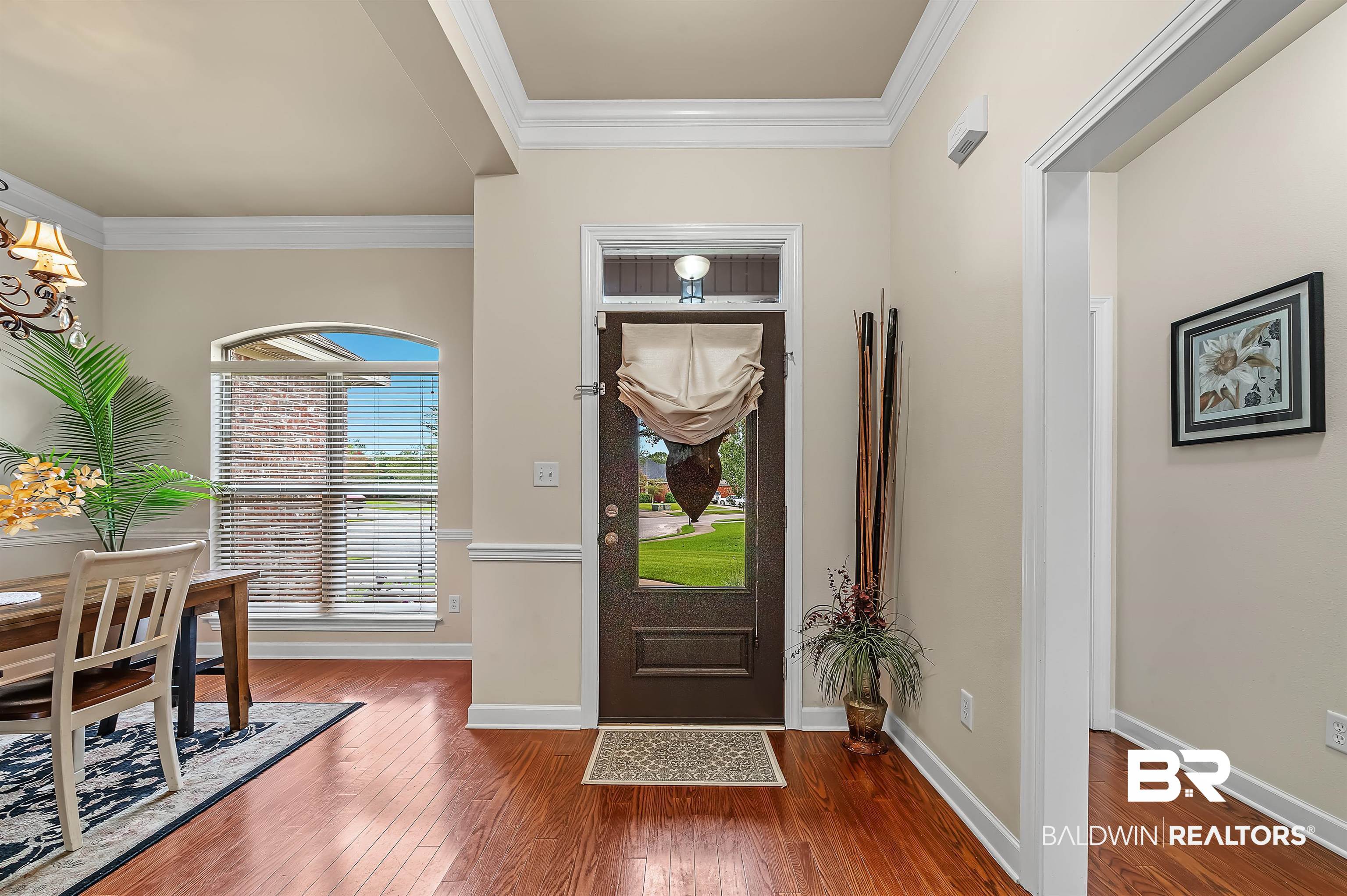 9376 Sable Court Daphne, AL 36526 - Photo 3 of 46 Foyer featuring ornamental molding and dark wood-type flooring