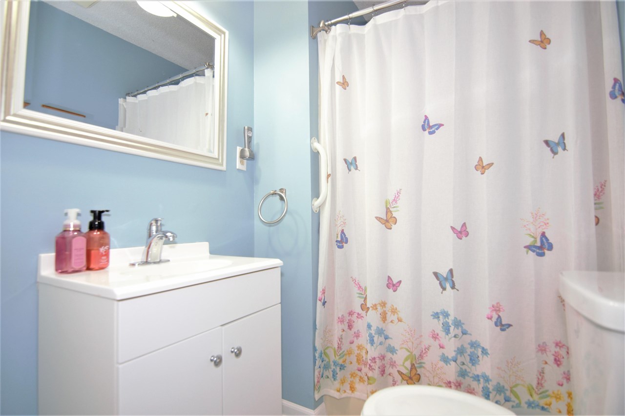 8517 Davidson Road Olive Branch, MS 38654 - Photo 12 of 24 a bathroom with a sink toilet vanity and shower