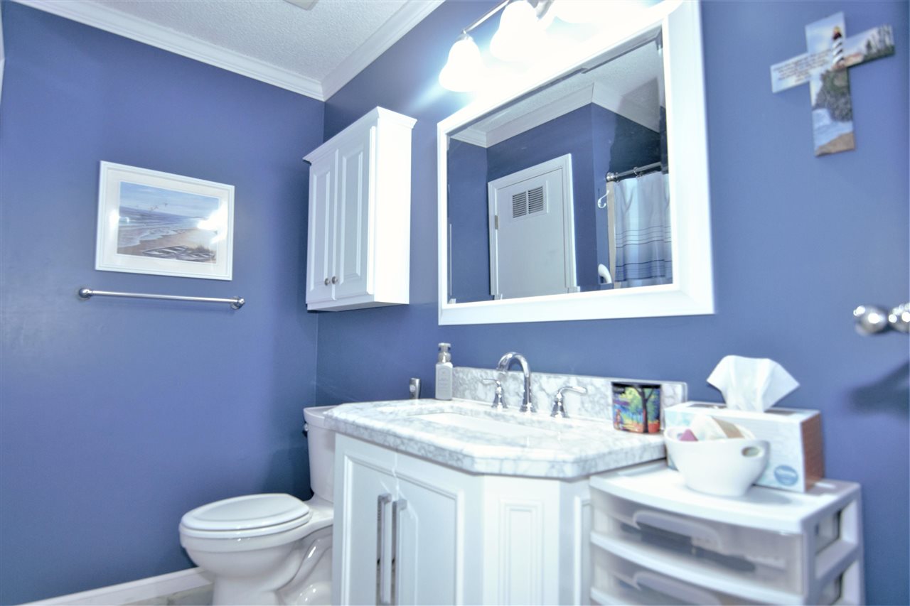 8517 Davidson Road Olive Branch, MS 38654 - Photo 14 of 24 a bathroom with a toilet sink and mirror