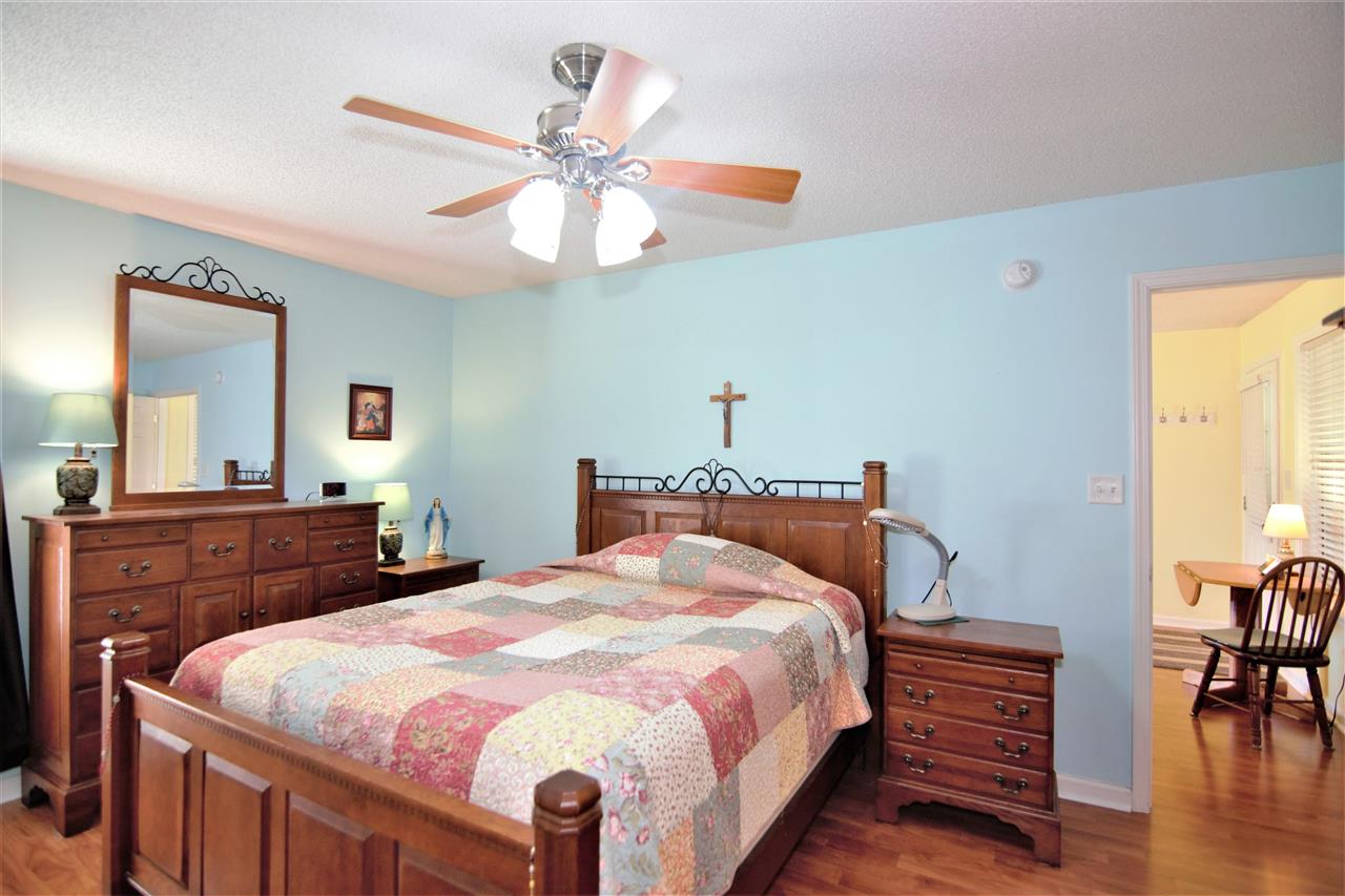 8517 Davidson Road Olive Branch, MS 38654 - Photo 19 of 24 a bedroom with a bed and wooden floor
